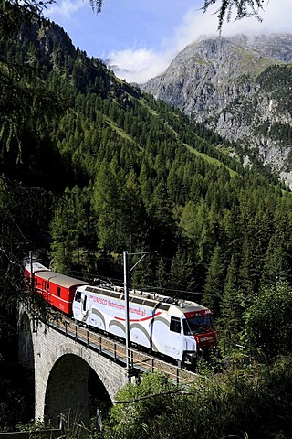 Train of the Rhaetische Bahn RhB Railway travelling on the Albula stretch between Berguen and Preda on a viaduct, Graubuenden, Switzerland, Europe