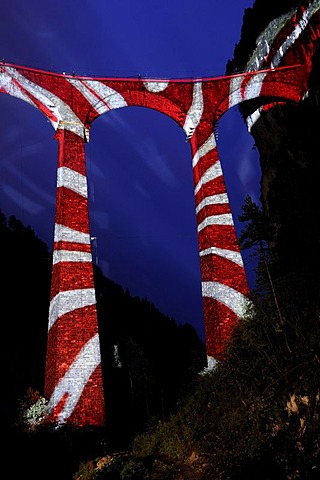 Irrigation water viaduct lit up with a graphic motif to celebrate the acceptance of the "Rhaetische Bahn Railway in Albula/Bernina" as a UNESCO World Heritage Site, Filisur, Graubuenden, Switzerland, Europe