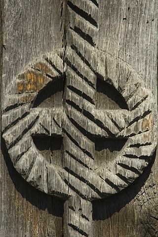 Carved wooden portal, disc symbolizing the sun, Maramures, Romania