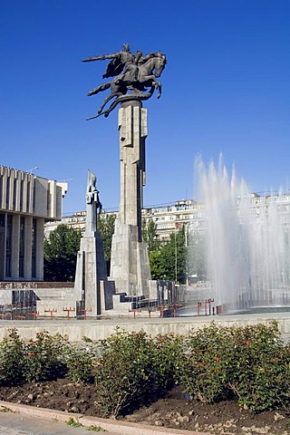 The Philharmonic house, in the foreground statues evocating the epic poem Manas, Bishkek, Kyrgystan