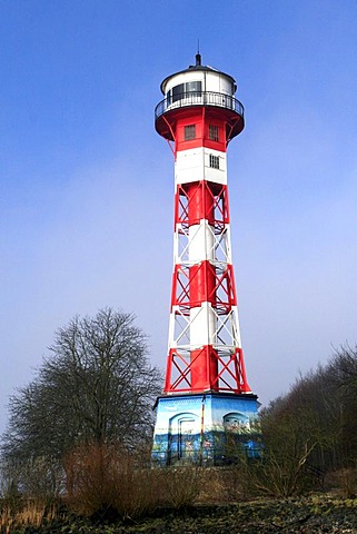 Lighthouse in fog on the banks of the River Elbe near Hamburg, Germany