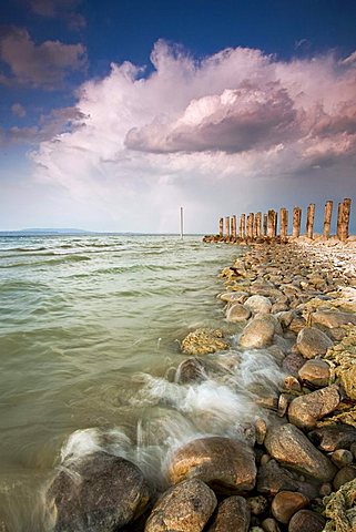 Stormy atmosphere and the rocky shore of Lake Constance, Altnau, Switzerland, Europe