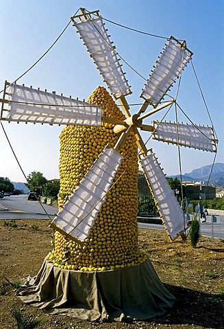 Windmill made of citrus fruit erected on the edge of a beach, Orange Festival, Soller, Majorca, Balearic Islands, Spain, Europe