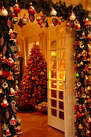 Christmas decoration, entrance in Christmas adornment with view to decorated Christmas tree in Villa Ambiente, Nuremberg, Middle Franconia, Bavaria, Germany, Europe