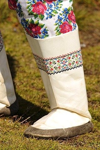 Boot of an Inuit wearing a traditional costume, folklore in front of a museum in Tasiilaq, Ammassalik, East Greenland, Greenland