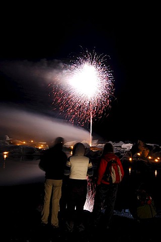 Fireworks on icebergs, glacier, Joekulsarlon, Iceland, Europe