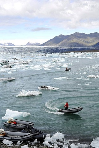 Boat between icebergs, rubber dinghies, glacier, Joekulsarlon, Iceland, Europe