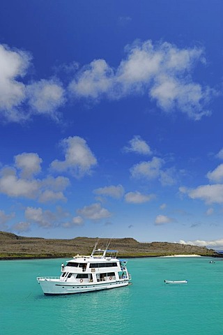 Boat in the snorkling paradise in the bay of Santa Fe Island, Galapagos Islands, Ecuador, South America
