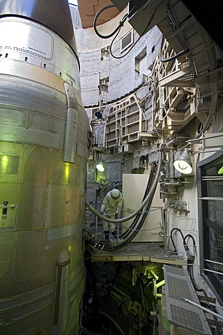 A Titan II missile in its underground silo at the Titan Missile Museum, a mannequin dressed in a protective suit is shown in a position to fuel the missile, Sahuarita, Arizona, USA