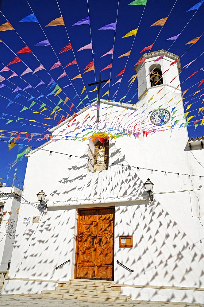 Small colourful flags outside Santa Ana Church during fiesta, Altea la Vella, Alicante, Costa Blanca, Spain