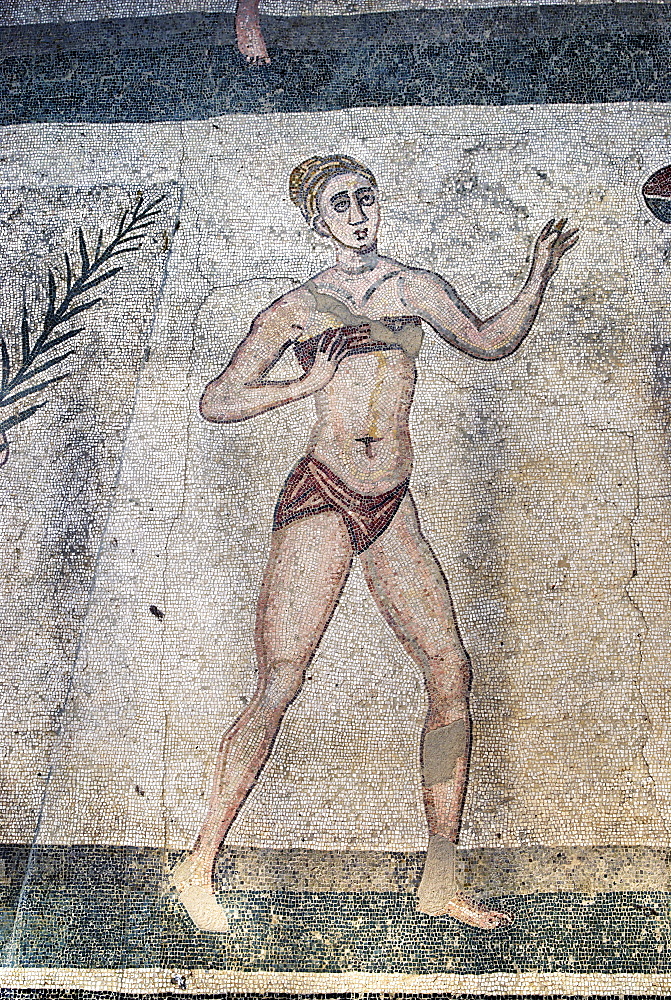 Girl with a bikini mosaic floor Villa Casale Piazza Armerina Sicily Italy