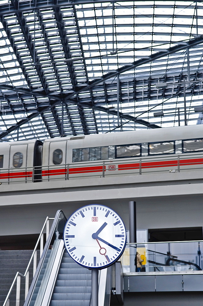 Station clock and ICE train, main station, Berlin, Germany