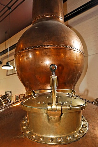 An old pot still (a giant copper kettle) used for the distillation in the Bushmills Whiskey Distillery, Bushmills, Londonderry, North Ireland