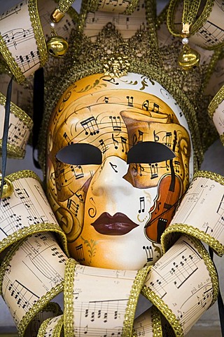 Venetian mask with notes and music motif, Venice, Veneto, Italy, Europe