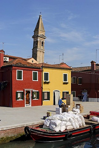 Colourfully painted houses and the leaning tower of the Church of St. Martino at a canal on Burano, an island in the Venetian Lagoon, Italy, Europe