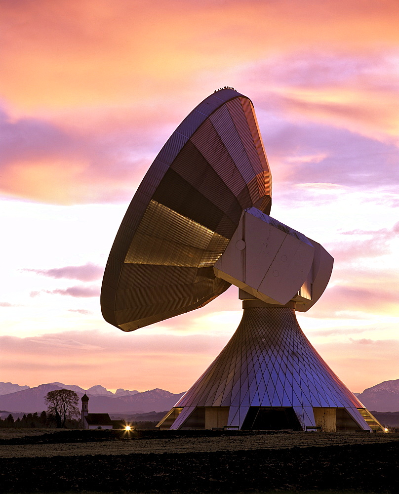 Dawn, lit antennas of the ground communication station Raisting, St. Johann Kapelle (Chapel) and Alps, Upper Bavaria, Germany