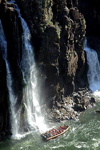 The Iguazu Falls at the border between Argentine and Brazil: White-water rafting under the cascades