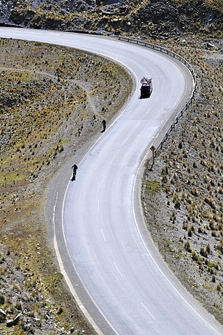 Mountainbikers descending an S-curve, Downhill Biking, Deathroad, Altiplano, La Paz, Bolivia, South America