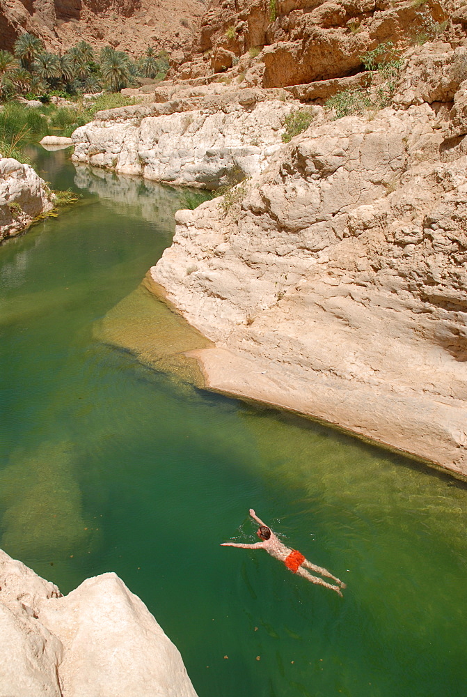 Swimming tourist, Wadi Tiwi, Oman