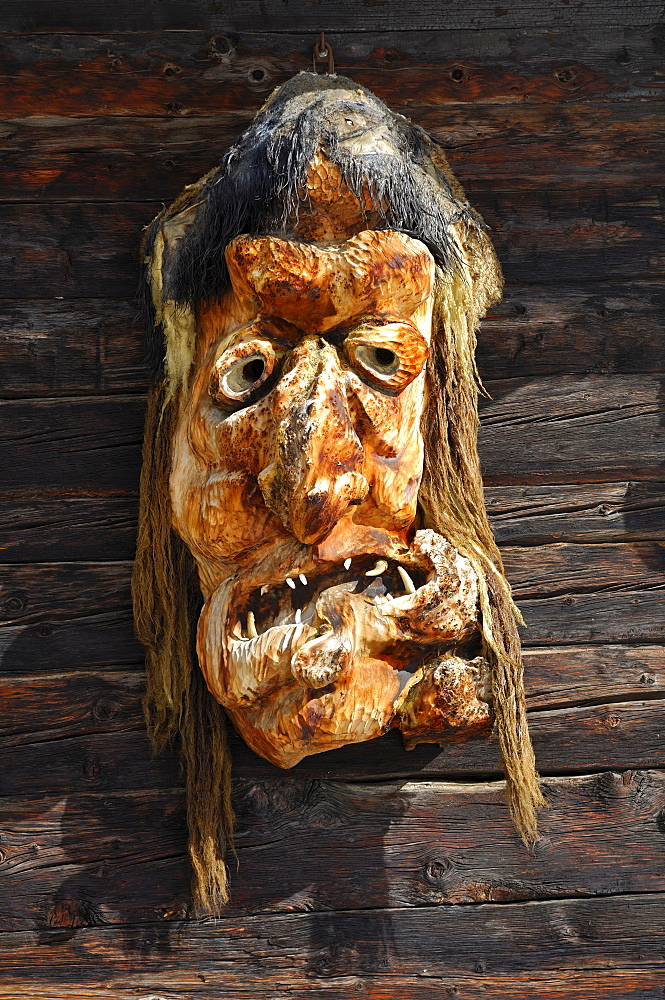 Traditional wooden mask made of Swiss pine wood, Wiler, Loetschental, Valais, Switzerland