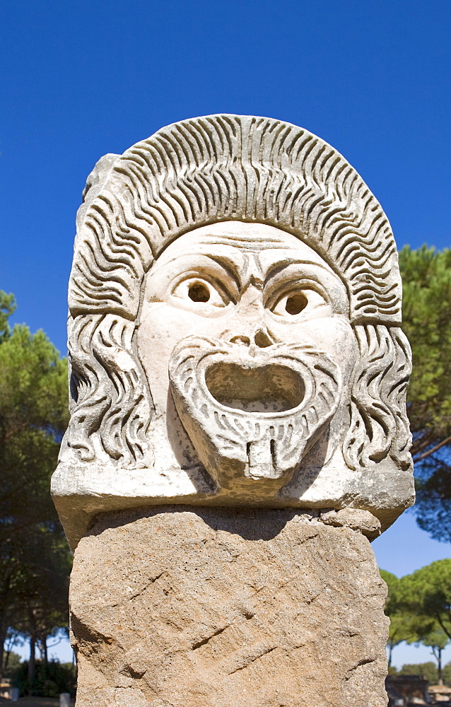 Comical masks at the amphitheatre at Ostia Antica archaeological site, Rome, Italy, Europe