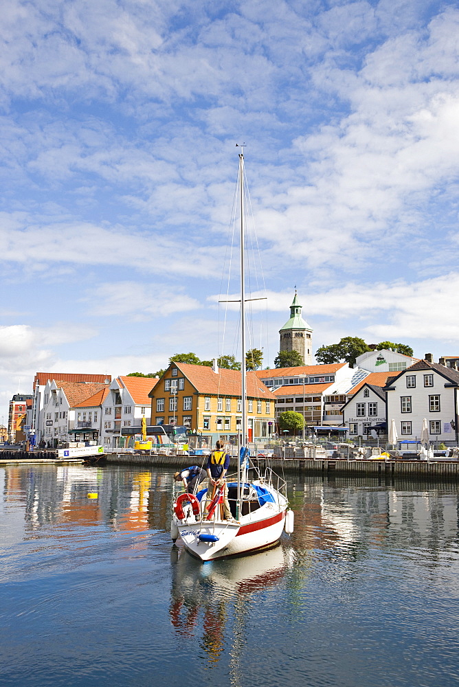 Sailboat in the harbour with Valbergtarnet, the former fire watch tower in the background, Stavanger (European Capital of Culture 2008), Norway, Europe