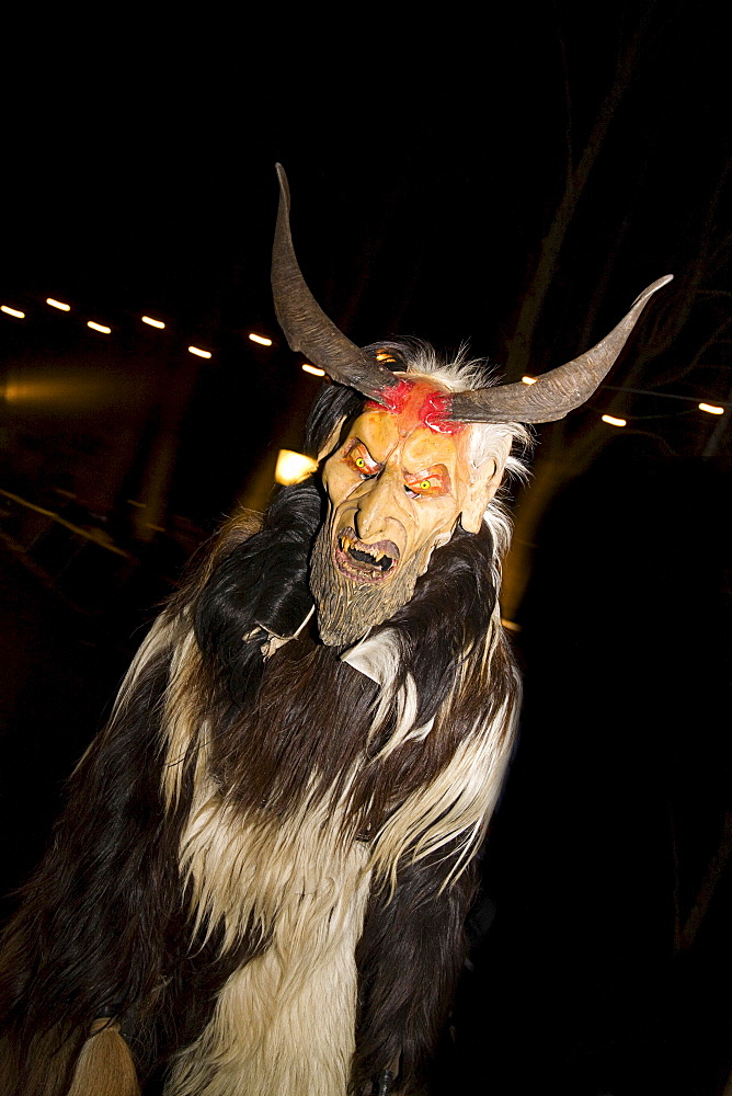 Krampus, a traditional Austrian figure bound to the tradition of St. Nicholas, he is the evil counterpart responsible for punishing and frightening the wicked children while St. Nicholas rewards the honest children, Reichenau at Mt. Rax, Lower Austria, Au