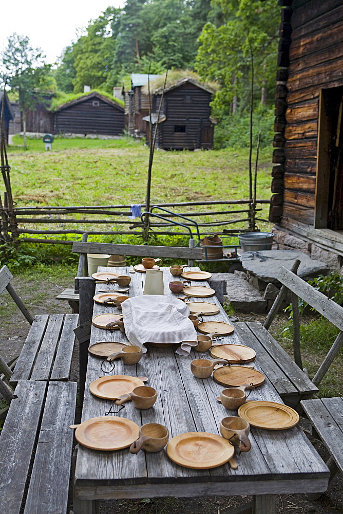 Historic table setting with wooden tableware in the Norsk Folkemuseum (Norwegian Museum of Cultural History), Bygdoy, Oslo, Norway, Scandinavia, Europe