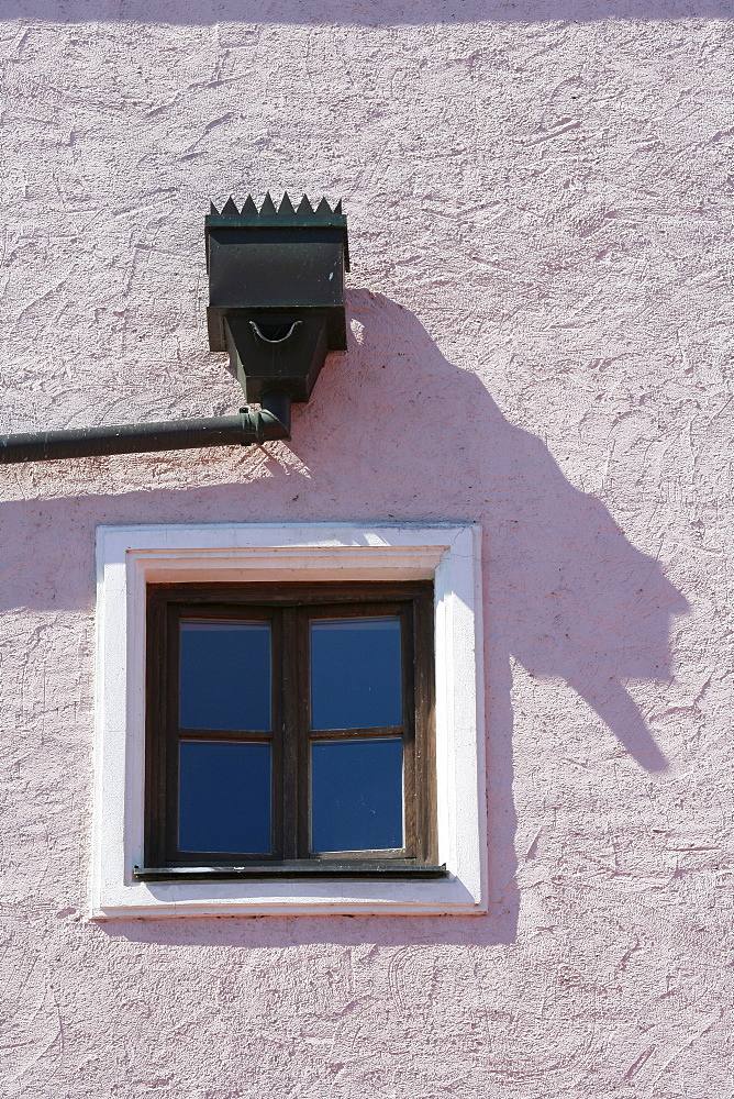 Window and eaves trough on a building facade in Muehldorf am Inn, Upper Bavaria, Bavaria, Germany, Europe