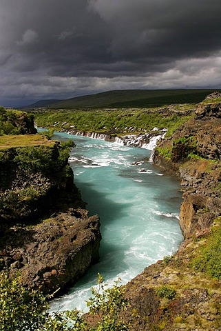 Hvita-River with Hraunfossar-Waterfalls (Lava-Waterfalls) at the right side near by the Langjoekull-Glacier in Iceland