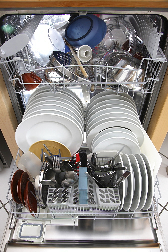 Clean dishes in dishwasher after a washing