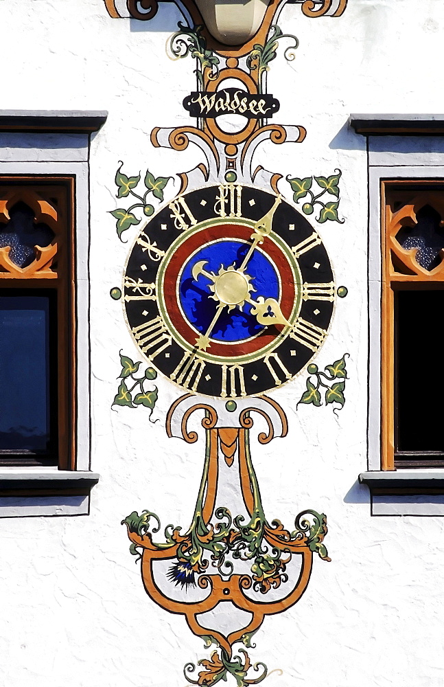 Ornate clock on the facade of the Gothic town hall in Bad Waldsee, Upper Swabia, Baden-Wuerttemberg, Germany, Europe