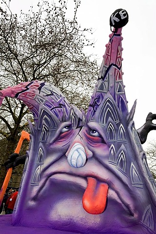 Ead of a fantasy figure with bandaged nose and tongue hanging out, caricature made of paper mache , monday before lent parade, Duesseldorf, NRW, Germany