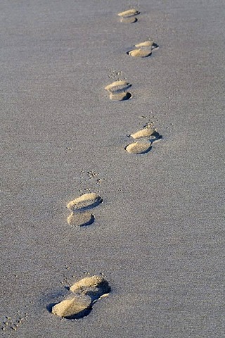 Impressions of shoes in the sand,