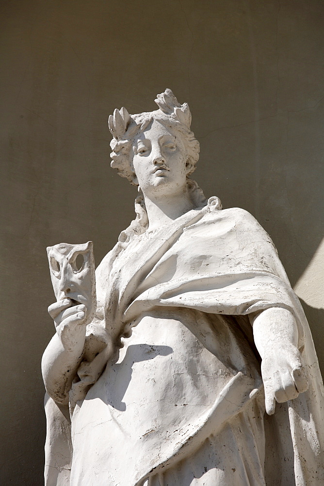 Sculpture holding a mask on the eastern facade of the Schleissheim Palace, Oberschleissheim near Munich, Upper Bavaria, Germany, Europe