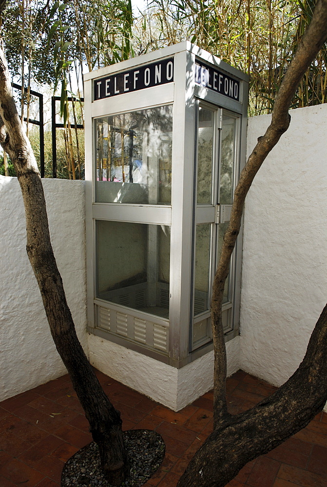 Telephone booth in barbecue area in the garden at the former home of surrealist painter Salvador Dali and his wife Gala in Port Lligat, Province Girona, Spain