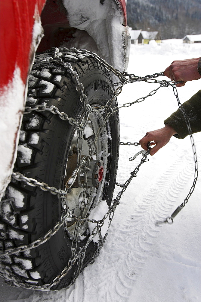 Car with snow chains, Germany.