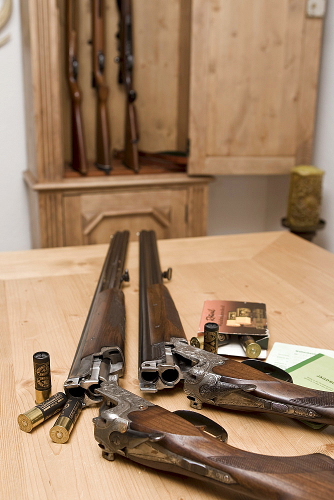 Two hunting weapons, shotguns, long guns with engraving, shooting license and gun ownership license