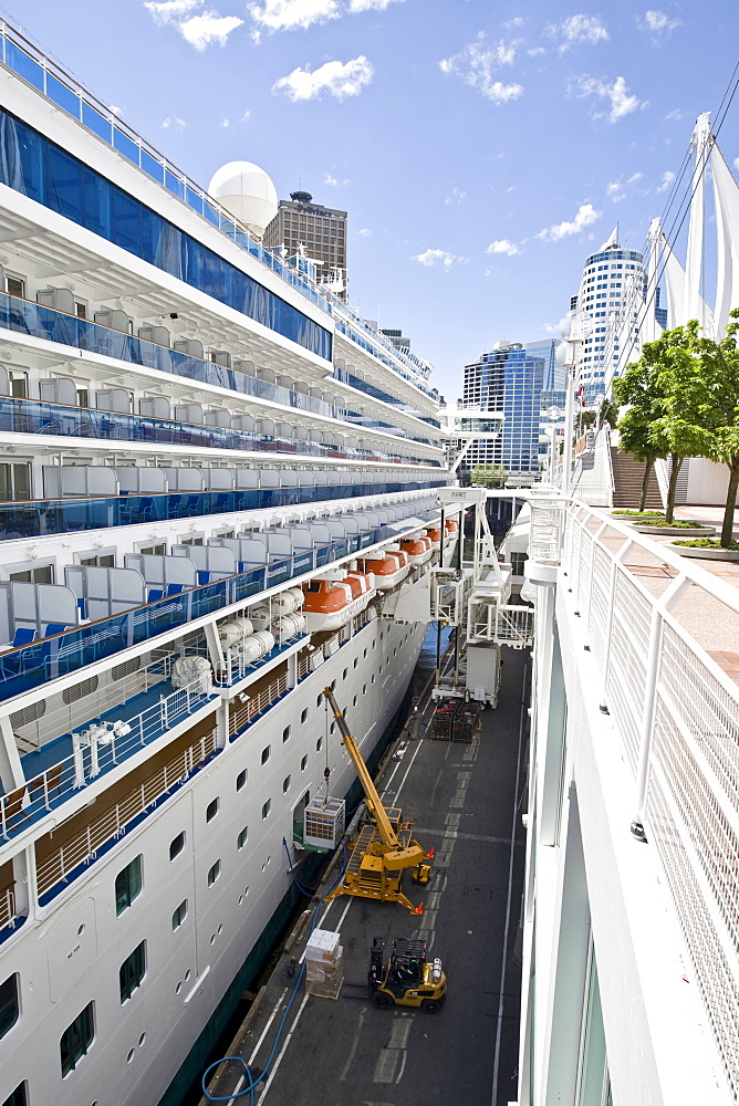 Passenger cruise liner "Diamond Princess" being loaded, docked in front of the Pan Pacific Hotel in Vancouver, British Columbia, Canada, North America