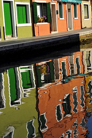 Colourful row houses reflected in water, Burano Island near Venice, Italy, Europe