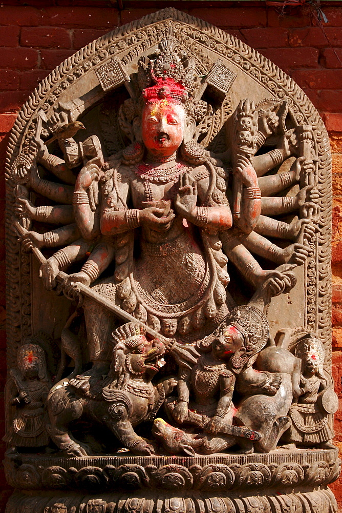 Statue of a multiple-armed god, Durbar Square, Bhaktapur, Nepal, Asia