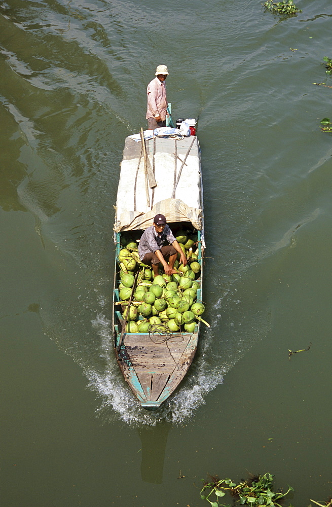 Transporting coconuts by boat, Mekong Delta, Vietnam, Asia