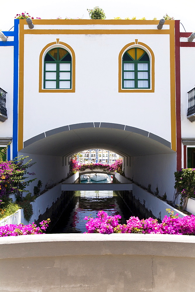 Canal thoroughfare under residential building, Puerto de Mogan, Gran Canaria, Canary Islands, Spain