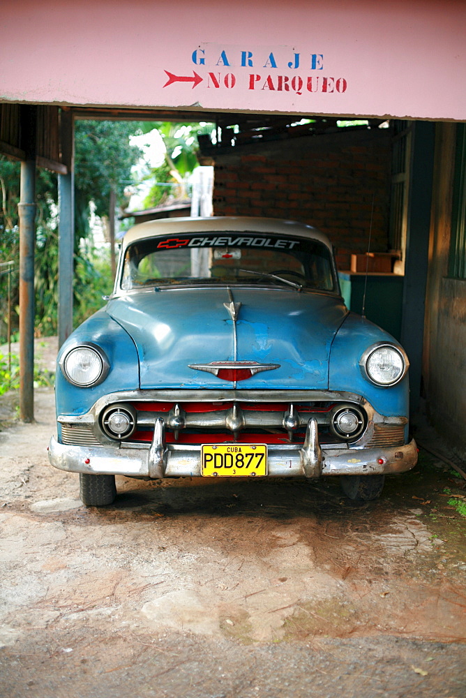 Vintage car in a garage in Vinales, Pinar del Rio Province, Cuba, Latin America