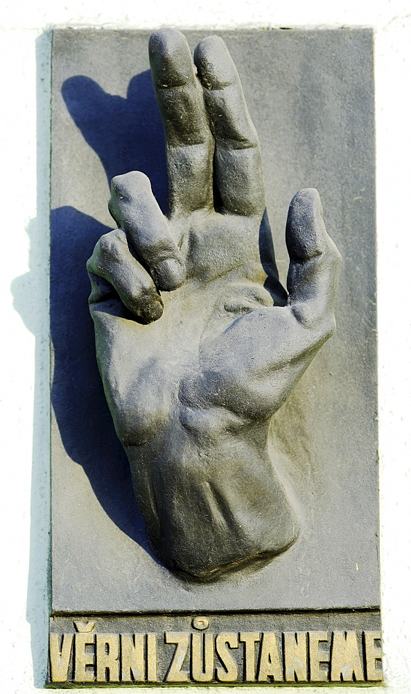 Hand sulpture on a building facade in the historic centre of Prague, Czech Republic, Europe