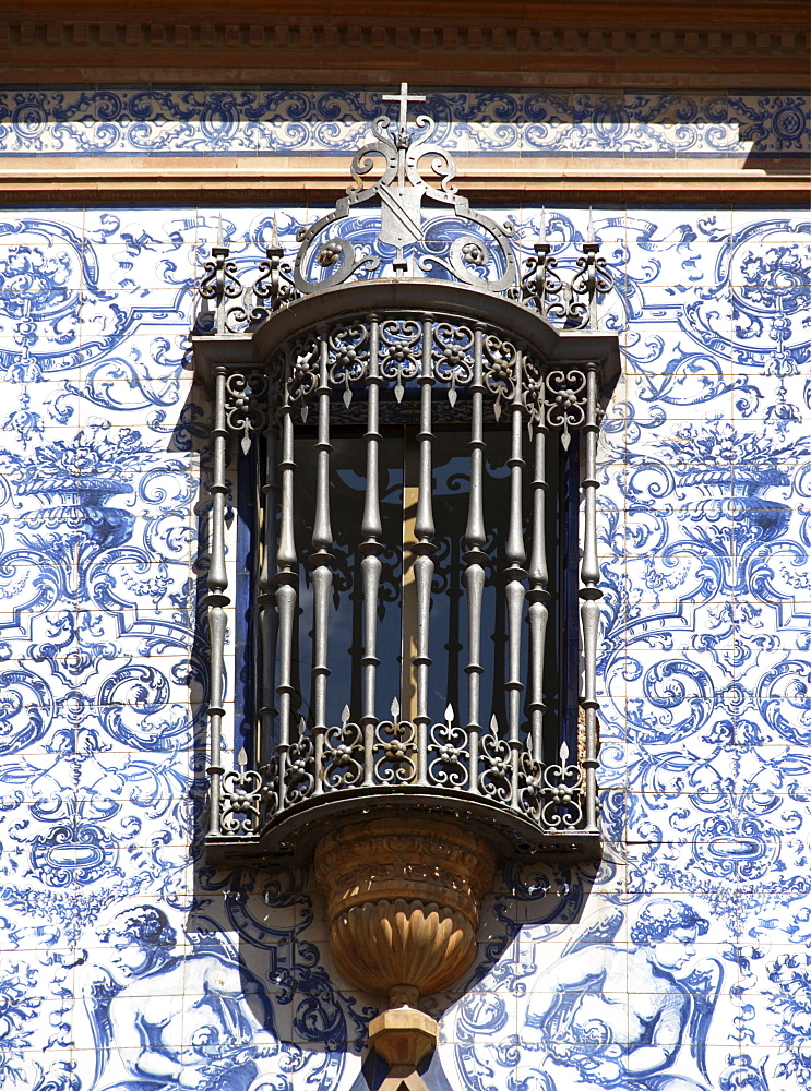 Ornate window of an old manor house in the centre of Seville, Andalusia, Spain