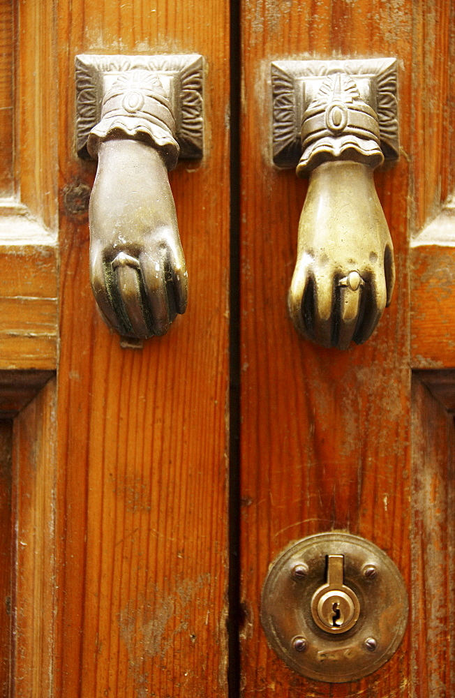 Two doorknobs, door handles on an old door, Seville, Andalusia, Spain