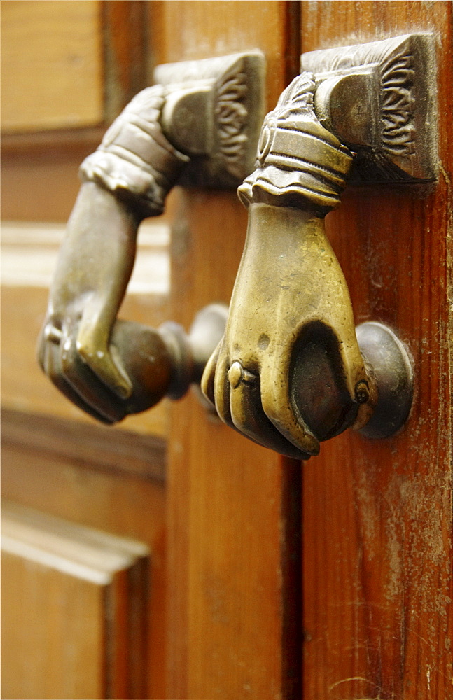 Two doorknobs, door handles on an old door, Seville, Andalusia, Spain