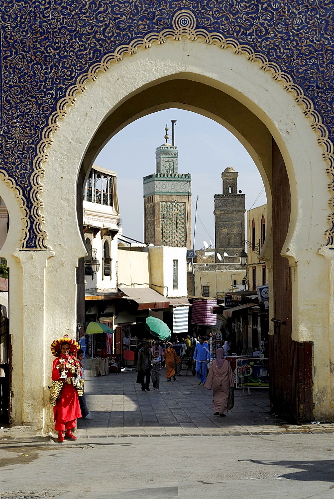 Water vendor standing in front of the Bab Boujeloud city gate, Fes, Morocco, North Africa