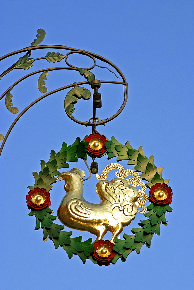 Sign with a golden cock in Beilngries Bavaria Germany.